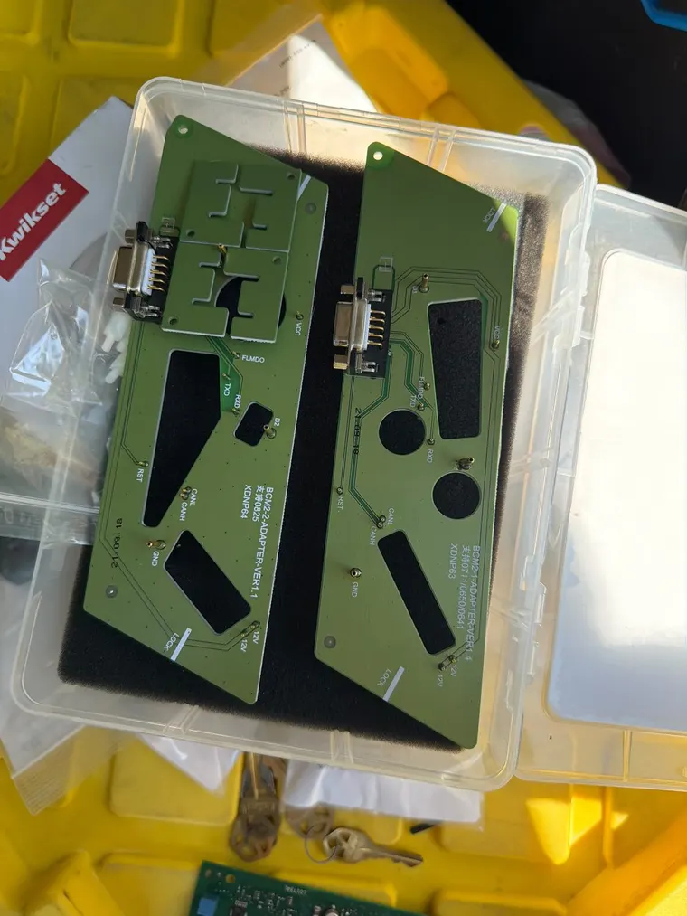 Body control module adapter boards in their storage case