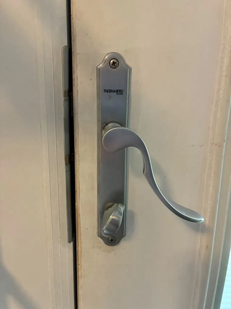 A newly fitted handleset on an interior door